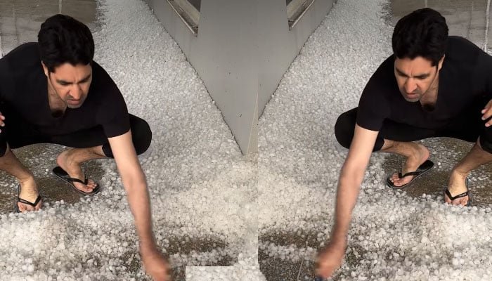 عمر گل اپنے گھر کے باہر سے برف ہٹاتے رہے